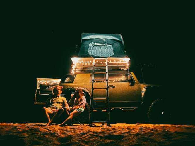 young couple enjoying camping