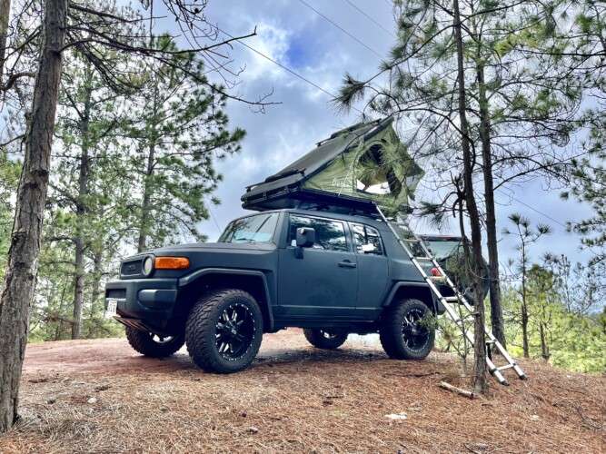 black jeep with rooftop tent