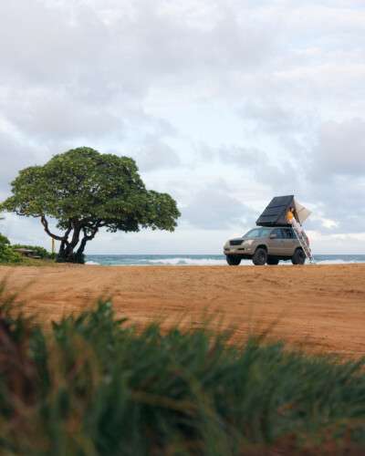 camper jeep parked on seashore