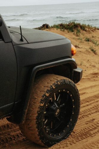 black jeep tyres covered in mud