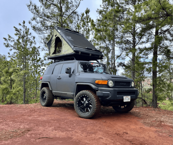 black jeep with rooftop tent