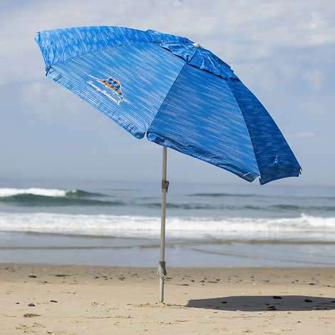 blue umbrella on seashore