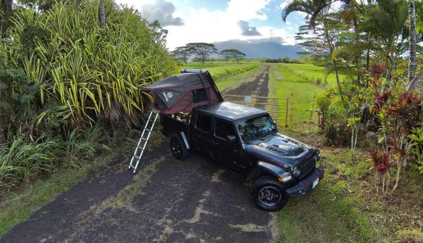 black camper with tent