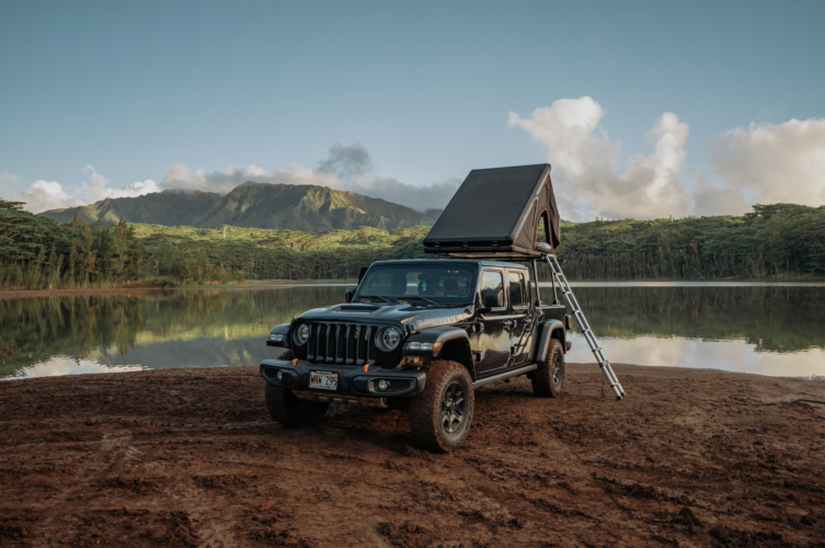 black jeep gladiator along side the lake