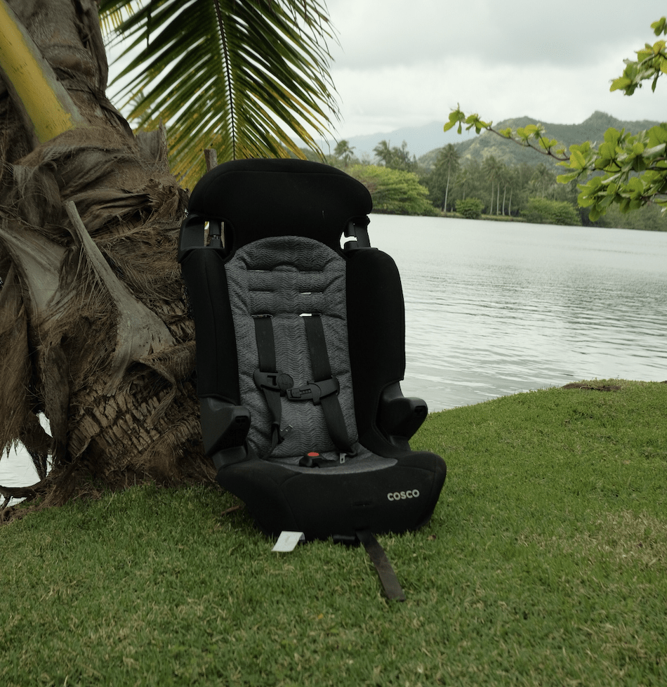 folding camping chair lying on lakeshore