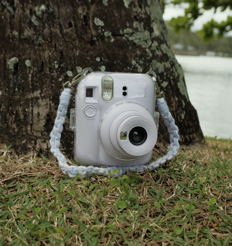 white camera lying on grass